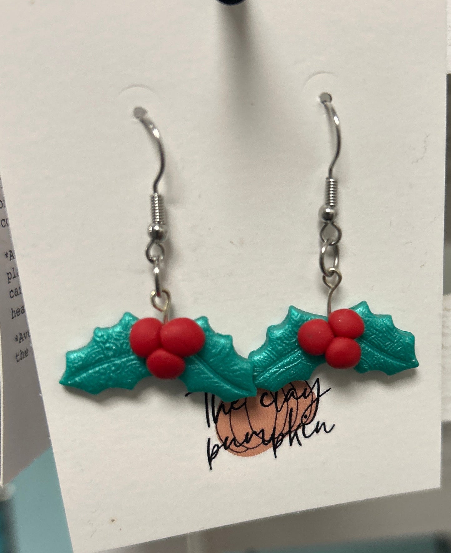 Holly dangles
